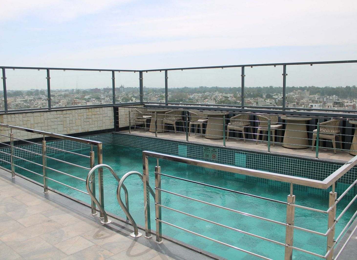 Rooftop swimming pool with city views at BluSalzz Residence, Amritsar.